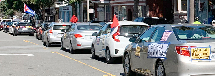 Cars with signs calling for an end to U.S. embargo of Cuba in San Francisco, March 28.