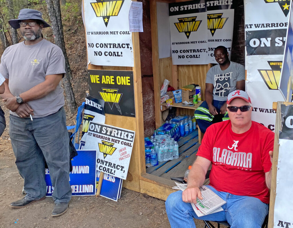 UMWA Local 2397 members Andre Ball, standing on left, and Ronnie Reynolds, seated in the right foreground, staffing the picket line at Warrior Met Coal’s No. 7 Mine West Portal.