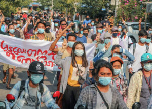 Demonstrators in Mandalay march April 14 demanding end to military rule.