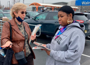 Candace Wagner, SWP candidate for New Jersey lieutenant governor, speaks with Shanice Williams March 28. Williams, a postal worker, signed to put Socialist Workers Party on ballot.
