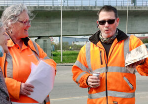 Natalie Garwood with Billy Spencer, a retired union delegate, at refuse workers’ picket in West Thurrock April 21. Garwood, the first woman refuse collector in U.K., has worked there 27 years. “Each time we’re forced to take action, we’ve come out on top,” she said.