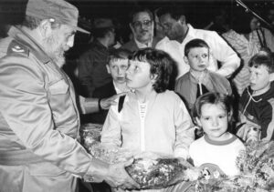 Cuban President Fidel Castro, left, greets children arriving from Ukraine, March 29, 1990. Over 25,000 affected by Chernobyl radiation poisoning, mainly from Ukraine but also Belarus and Russia, received free medical treatment under internationalist program of Cuban Revolution.