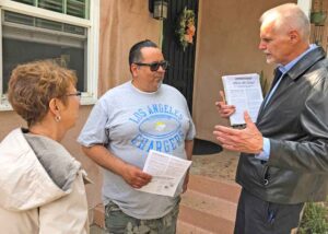 Dennis Richter, right, Socialist Workers Party candidate for governor of California, and campaign supporter Alyson Kennedy talk to Long Beach port worker Javier Marquez May 16. Marquez got Teamster Rebellion to learn how revolutionary-minded unionists fought in 1930s.