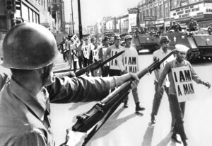 Striking sanitation workers march in Memphis in 1968, registering courage, discipline and dignity at proletarian heart of battle against Jim Crow segregation. “That battle remains an example for us today, as the pent-up anger explodes over decades of police brutality and cop shootings,” Waters said.