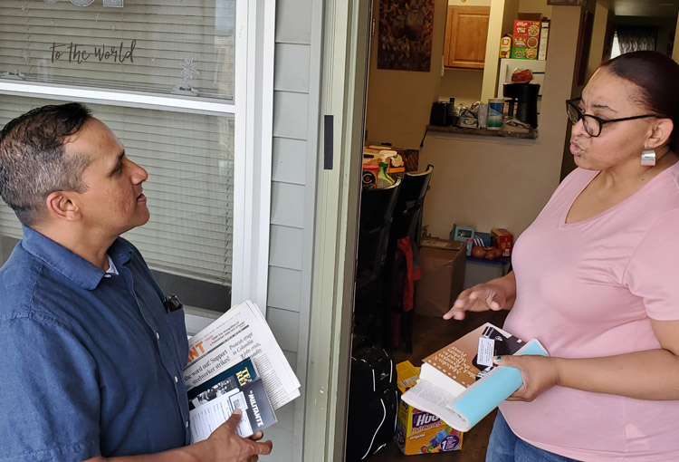 Ved Dookhun, SWP candidate for mayor of Albany, speaks to Francesca Jones on her porch May 21. Jones subscribed to Militant, got Malcolm X, Black Liberation, and the Road to Workers Power.