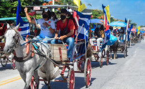 Caravan through Holguín, Cuba. Caravans and rallies protesting U.S. government’s economic war against people of Cuba took place around the world June 20, three days before U.N. voted to demand end to Washington’s embargo on Cuba.
