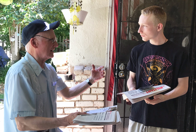 Joel Britton, left, Socialist Workers Party candidate for California State Assembly District 18, talks with Quenton Hilton, a mechanic, in Fresno May 29. “Only on the job can workers fight together for higher wages, safer working conditions,” Britton said. “Yes!” Hilton agreed.