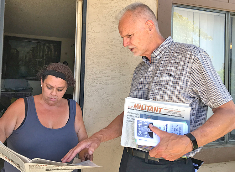 Dennis Richter, SWP candidate for California governor, talks to unemployed home care worker Liliana Garcia in San Ysidro June 11 about amnesty for undocumented workers living in U.S.