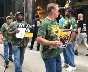 Members of United Mine Workers on strike against Warrior Met Coal in Brookwood, Alabama, and supporters picket one of company’s owners, BlackRock hedge fund, in New York June 22.