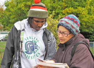 Cecelia Moriarity showing Militant, books by Socialist Workers Party leaders, other revolutionaries to Darralita Taylor in Seattle in 2013. She explained Militant was uncompromising.