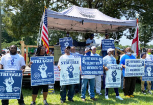 Members of International Longshoremen’s Association from three East Coast ports join miners’ rally in Alabama Aug. 4, pledge to spread word, build support for hard-fought strike.