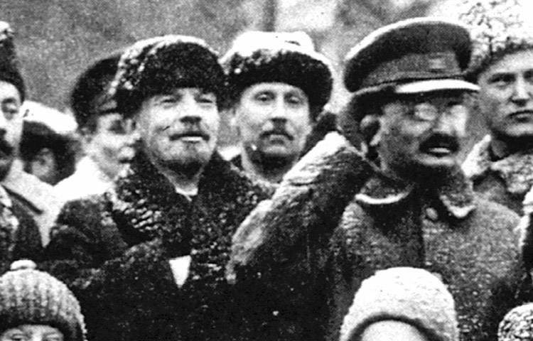 V.I. Lenin, above left, leader of Russian Revolution, pictured alongside Leon Trotsky, commander of Soviet Red Army, Nov. 7, 1919. Inset, Joseph Stalin ordered Trotsky and others crudely airbrushed out of history as his bureaucratic machine prepared purge of those revolutionary leaders fighting for Lenin’s proletarian internationalist course.