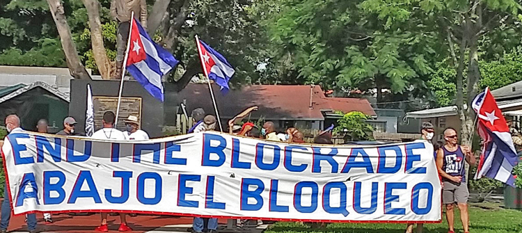 Caravans, rallies and meetings took place in U.S., Canada, U.K. and elsewhere Aug. 29, protesting Washington’s economic war against Cuba. Above, protesters at Toussaint L’Ouverture park in Miami donated to Haiti earthquake relief.
