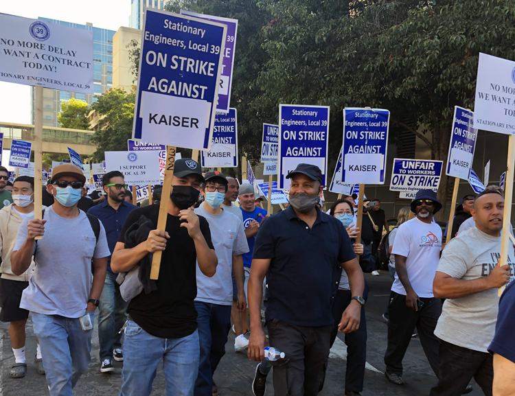 Striking members of International Union of Operating Engineers Local 39 march on Kaiser headquarters in Oakland, Sept. 30, in fight for higher wages, new contract at 24 hospitals.