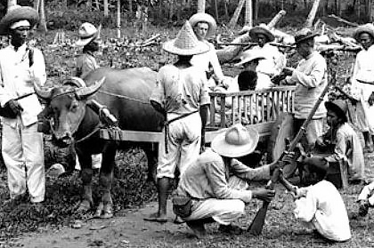Filipino fighters in Cavite province, Philippines, in 1898. A 3-year war to repel U.S.imperialist annexation followed. Over 200,000 civilians, 20,000 guerrilla fighters and 4,500 U.S. troops died. Black soldiers in U.S. Army sympathized with Filipino fighters, many deserting to fight at their side.