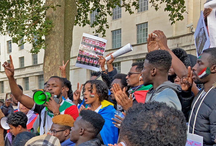Protesters in London, Oct. 30, join in solidarity with hundreds of thousands who marched in Sudan to demand overthrow of military coup carried out a week earlier. “We have lived under these conditions for generations,” said Randa Ahmad-Hassan at the demonstration.
