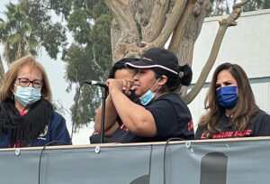 Elvia Castillo, striker at Jon Donaire Desserts plant in Los Angeles County, California, speaks at rally Dec. 3. Strikers’ union is Bakery, Confectionery, Tobacco Workers and Grain Millers.