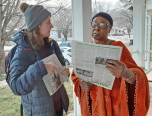 Kaitlin Estill, left, talks with hospital worker Jannie Jackson in Cincinnati Jan. 18. “All the companies care about is how they can make more money from our hard work,” said Jackson.