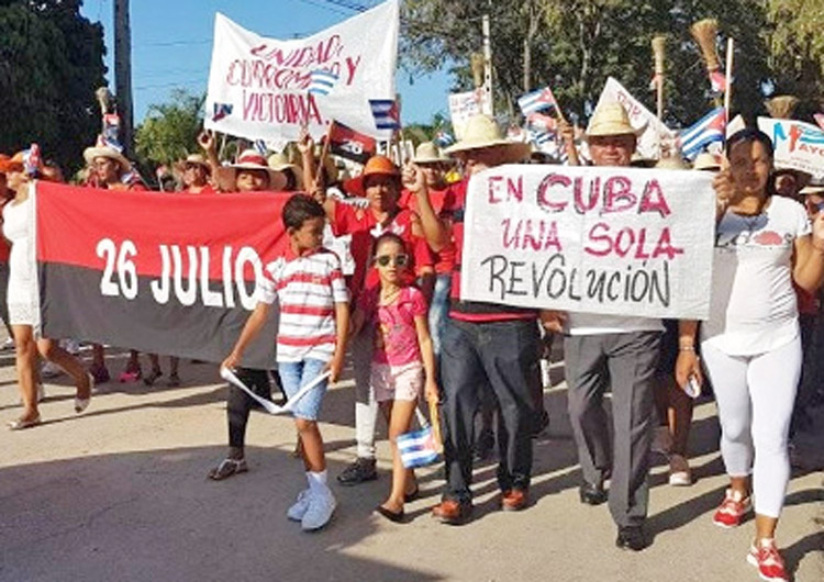 May Day march in Contramaestre, Santiago de Cuba, May 1, 2019, celebrates Cuban Revolution. May Day Brigade members will join 2022 march in Havana, meet with mass organizations.