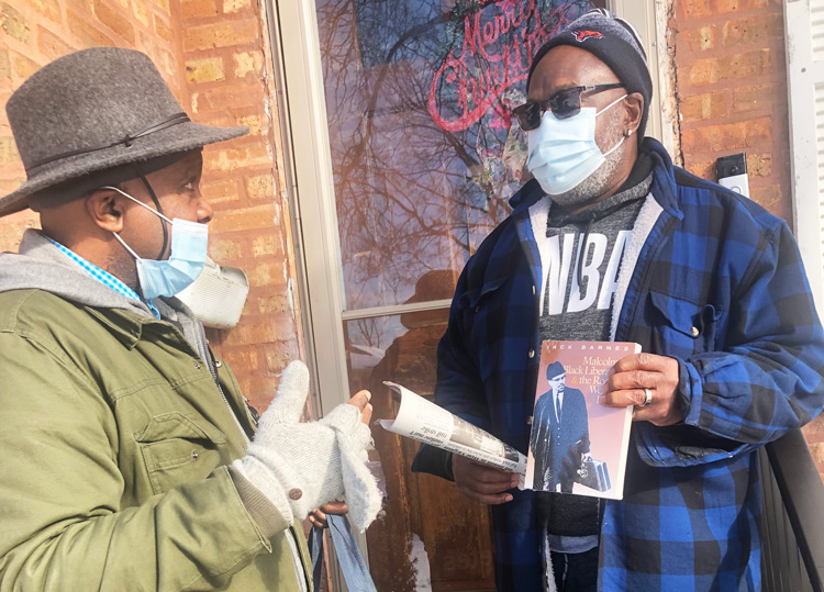 SWP campaigner Leroy Watson, left, spoke to train car repairman William Robinson in Broadview, Illinois, Feb. 6. He renewed Militant subscription, looks for further discussions.