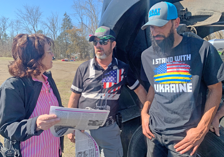 Arlene Rubinstein, Socialist Workers Party candidate for Washington, D.C., Delegate to the House, speaks with Wes Short, left, at trucker-led protest in Hagerstown, Maryland, March 16.