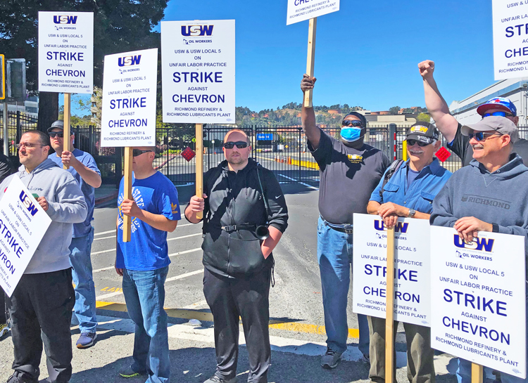 Striking members of United Steelworkers Local 5 picket the Chevron refinery in Richmond, California, March 21. They are in a fight over forced overtime, wages and safety conditions.