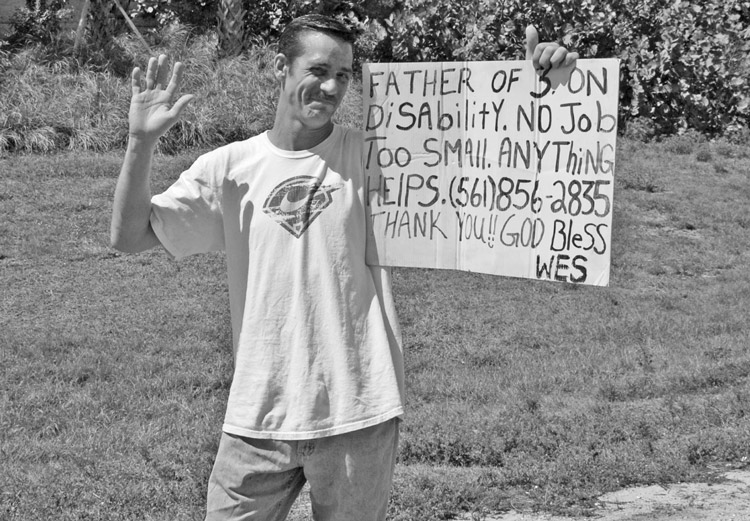 Worker in Palm Beach County, Florida, looking for a job. Officials there have outlawed soliciting or panhandling on or near any road, restricting free speech and attacking political rights.