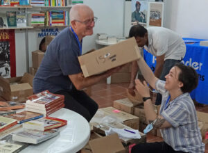 Volunteers setting up Pathfinder Press booth on eve of Havana International Book Fair.