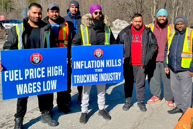 Members of Ontario Aggregate Trucking Association picket entrance to quarry in Milton, Ontario, March 21, part of two-week strike which won workers a 20% wage raise.