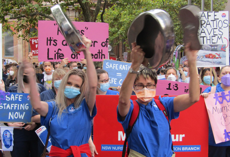 Demanding lower, fixed nurse-to-patient ratios, thousands of nurses and midwives in New South Wales, Australia, struck for a day and rallied outside Parliament March 31.