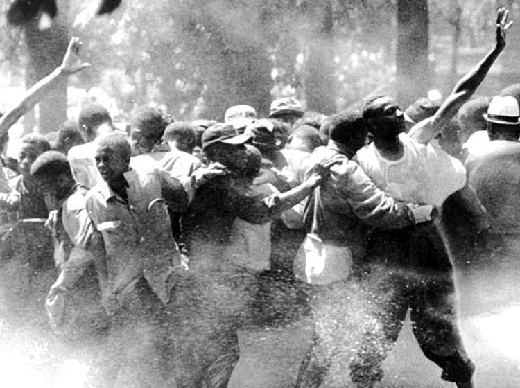 Above, demonstrators attacked by police in Birmingham, Alabama, 1963, during massive national movement that overthrew Jim Crow segregation. Fight against discrimination and racist violence is key part of working-class fight for political power, as is the fight against all manifestations of Jew-hatred. Inset, New York 2020 march of 25,000 after series of antisemitic attacks.