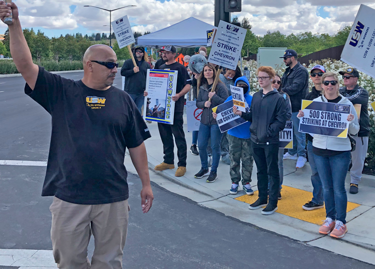 Striking refinery workers picket entrance to Chevron corporate headquarters in San Ramon, California, May 10. Workers are fighting for wage raises, safety, sustainable work schedules.