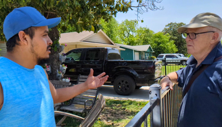 SWP campaigner George Chalmers, right, talks to roofer Manuel Hernandez April 30 in Ft. Worth, Texas, about job safety. He wants a return visit to subscribe, get books.
