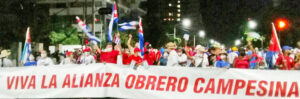 , Havana May Day march. Banner below says, “Long live the Worker Peasant Alliance,” key to Cuba’s socialist revolution.