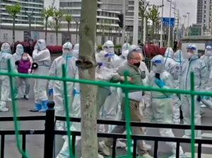Working people protested eviction from their homes in Shanghai, mid-April, as apartment block was turned into COVID isolation facility. They were removed by cops in protective suits.