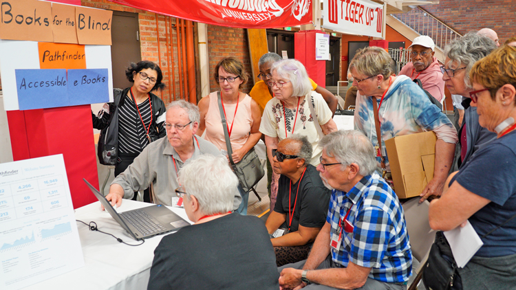 Conference participants learn about plans by party supporters to expand the production of Pathfinder books in numerous formats to reach working people who are blind or visually impaired.