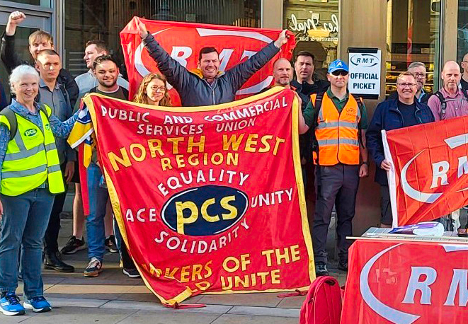 Picket line by rail workers in Manchester, England, June 21, part of daylong strike actions by more than 40,000 RMT members across the country for better pay and opposing job cuts.