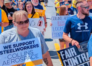 Steelworkers members locked out by Collins Aerospace in Union, West Virginia, march there June 4, getting out word about their fight and winning solidarity.