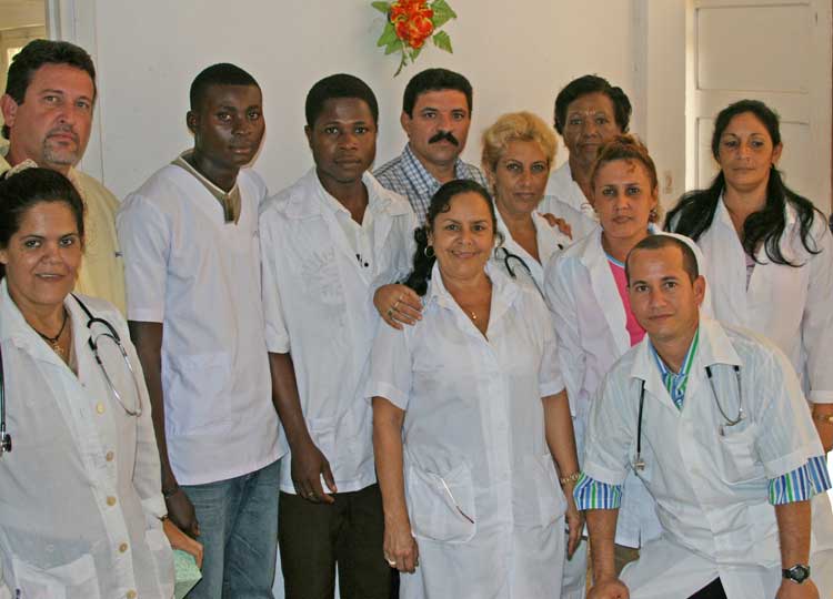 Cuban medical brigade at Ebebiyin hospital, Equatorial Guinea, July 28, 2008, with Guinean students, third and fourth from left, is example of internationalism of Cuba’s workers, farmers.