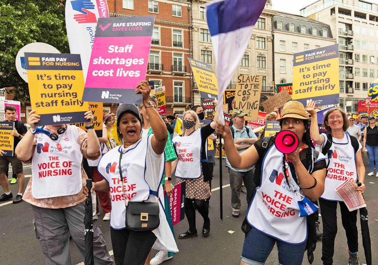 Nurses march in London June 18 demanding government pay higher wages. Nervousness of U.K. rulers amid spreading shifts in capitalist “world order” and rising working-class anger over assaults on living standards led Conservative Party leaders to oust Boris Johnson.