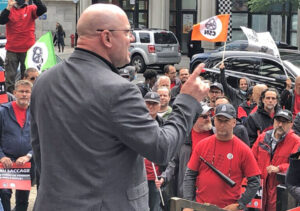 Frédéric Labelle, president of Montreal local of CSN workers locked out by Rolls-Royce, speaks to unionists outside Montreal courthouse June 22, the day after bosses fired him.