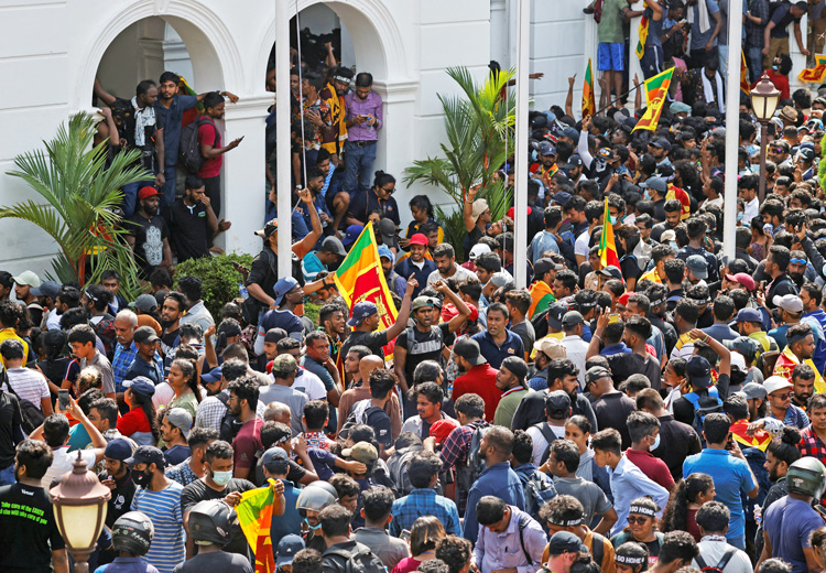 Protesters demanding resignation of Sri Lankan government rally at office of Prime Minister Ranil Wickremesinghe in Colombo July 13. Fight has united all Sri Lankan ethnic groups.