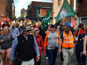 Aug. 20 Manchester rally during strike by 40,000 members of Rail, Maritime and Transport union for a pay raise, better schedules. Rail strikes were one of many union actions across UK.