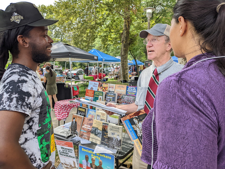 Chris Hoeppner, SWP candidate for U.S. Congress from Philadelphia, talks with Theodore Ramsen, left, and Sedia Ali at farmers market July 16, two of the 2,422 who signed petition to put him on ballot. SWP is preparing to fight any effort by the state to deny SWP ballot status.