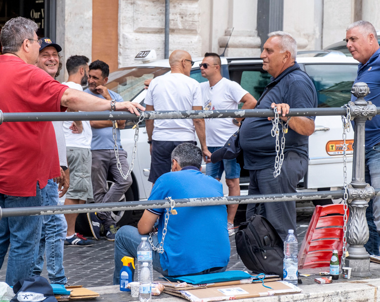 Taxi drivers protest working conditions in Rome July 13 outside office of former Prime Minister Mario Draghi. The Italian government collapsed, Draghi resigned July 21 amid EU tensions.
