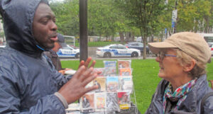 Katy LeRougetel, Communist League candidate for Quebec’s National Assembly in Montreal, talks with Mamadou Konate Sept. 18 at action protesting deportation of immigrant workers.