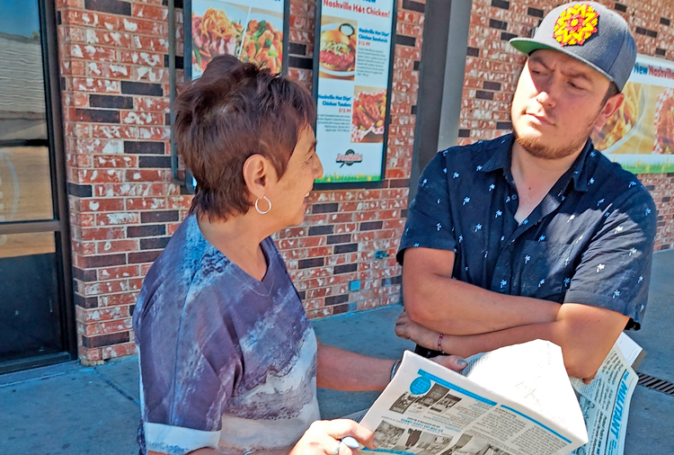 SWP campaigner Josefina Otero talks with Rafael Ramirez at truck stop outside Fort Worth, Texas, Sept. 27, about importance of fight to defend constitutional rights in face of FBI attacks.