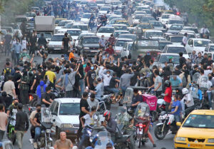 Demonstrators block traffic in downtown Tehran, Sept. 21, 2022. Protests have spread across every province, over 80 cities in Iran, into Kurdish region of Iraq, and around the world.