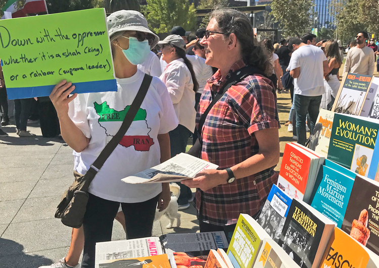 Deborah Liatos, right, SWP candidate for U.S. Congress, talks with people at rally of thousands in Los Angeles Oct. 1 protesting death of Mahsa Amini in Iran after arrest by “morality” police.