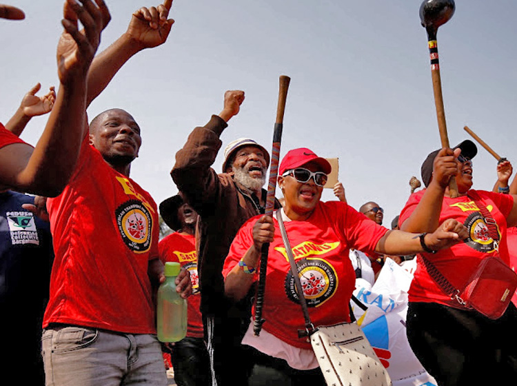 Unionists at South Africa’s state-owned logistics firm Transnet in Durban. National strike by 30,000 workers Oct. 6 shut ports, freight rail, for pay and benefit rises to match price hikes.